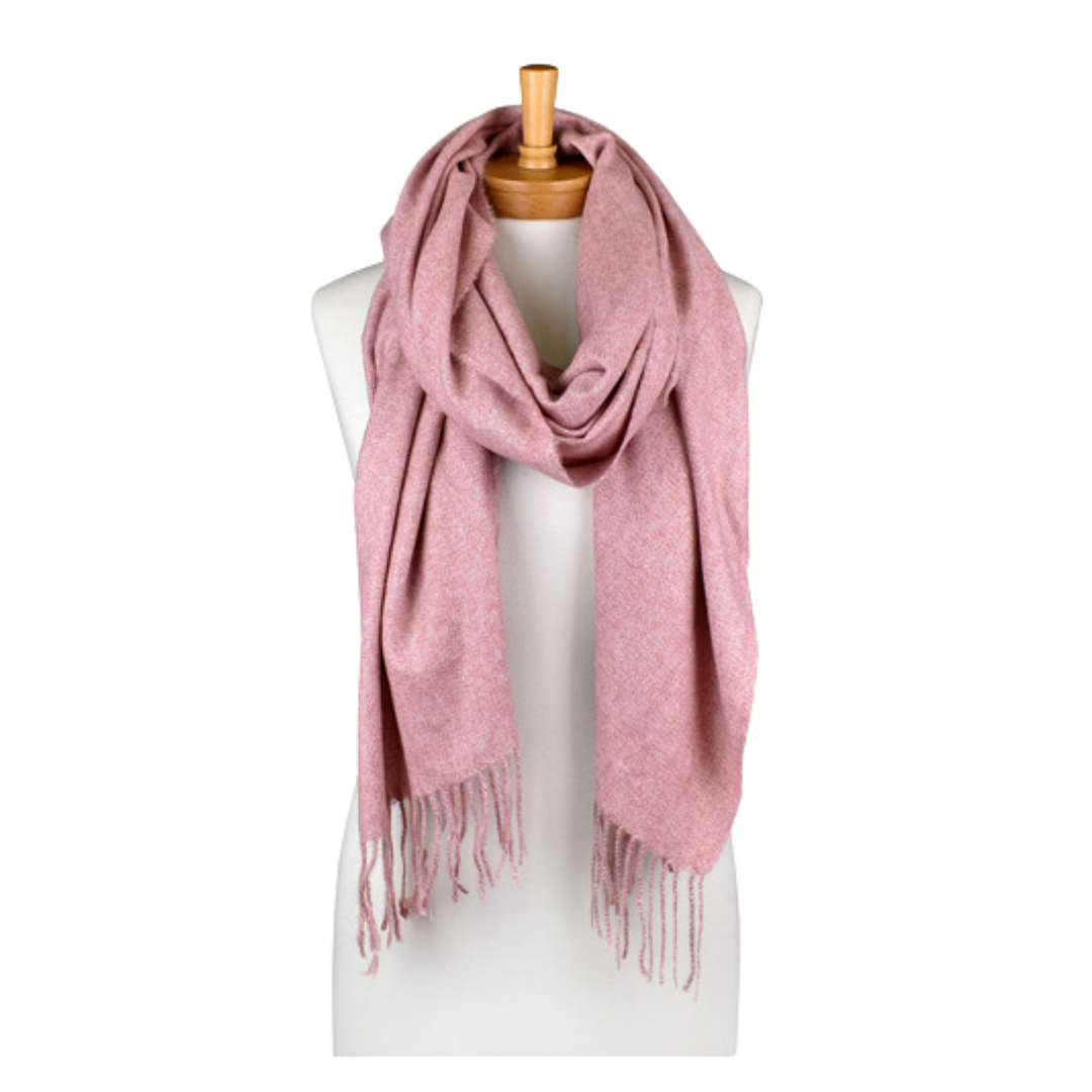 a plain dusty pink coloured scarf that has tassels and is draped around a mannequin. The scarf is very soft and warm.