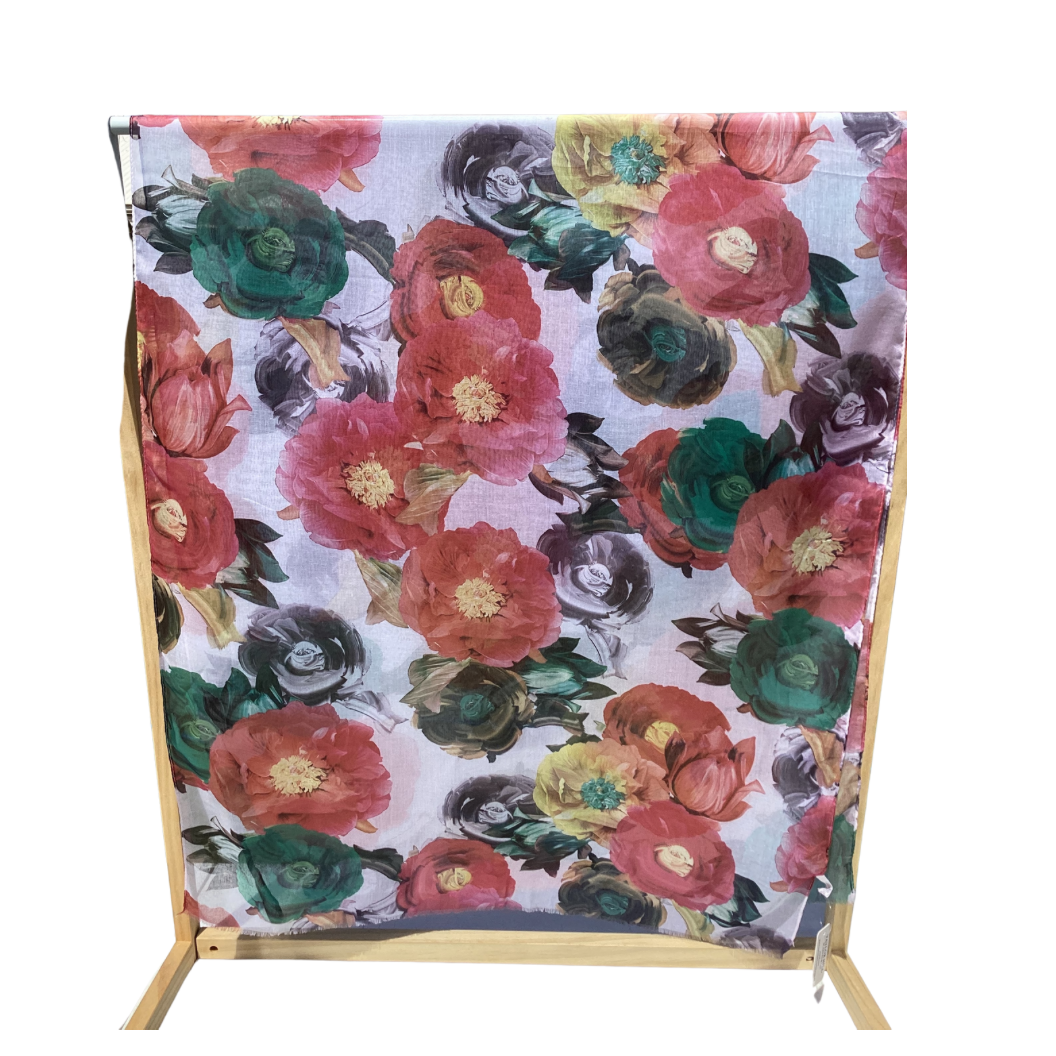 a floral rose ladies scarf in shades of emerald green, red and grey on a white background