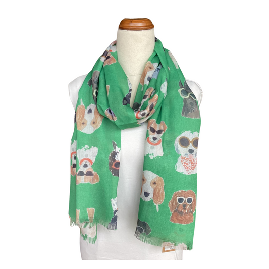 a ladies scarf that has a bright green background and drawings of cute dogs