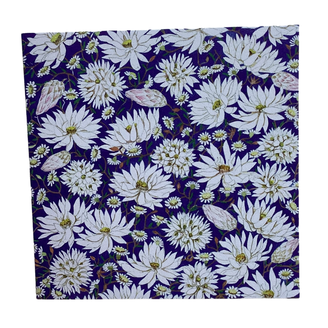 a small square greeting card that has a navy background and white paper daisy floral artwork by Phillipa Nikulinsky.