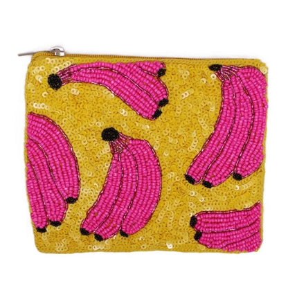 Pouch with pink banana design on a yellow sequined background
