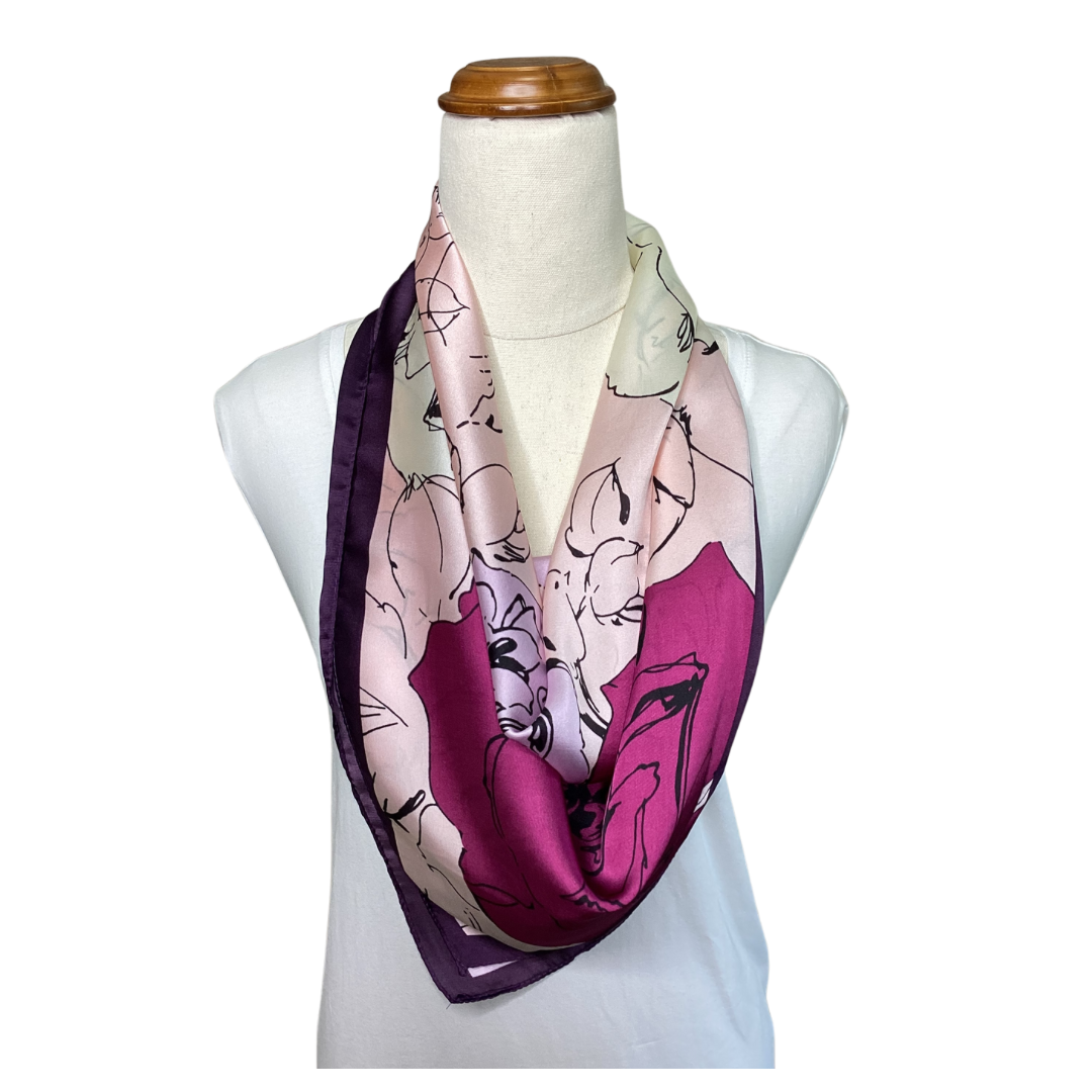 a satin ladies scarf with fuchsia pink and pale pink flowers and a dark purple border