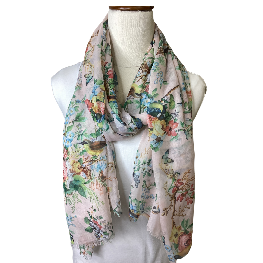 a pretty pale pink ladies scarf with birds, butterflies and flowers