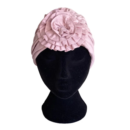 pink hair turban on a black head mannequin