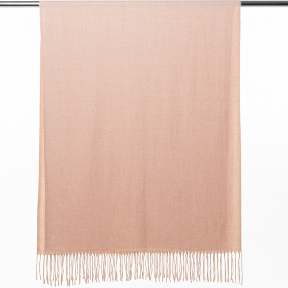 A soft and warm ladies scarf that is plain light red in colour. The scarf is soft and warm and has tassels. The scarf is draped over a hanger so you can see the tassels.