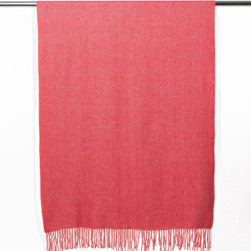 A soft and warm ladies scarf that is plain light red in colour. The scarf is soft and warm and has tassels. The scarf is hanging so you can see the tassels.