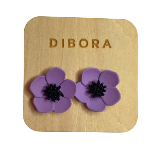 floral polymer clay stud earrings with a black centre