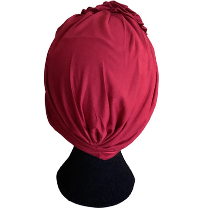 back view of a red hair turban on a head mannequin