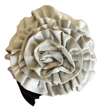 close up view of a hair turban on a black head mannequin