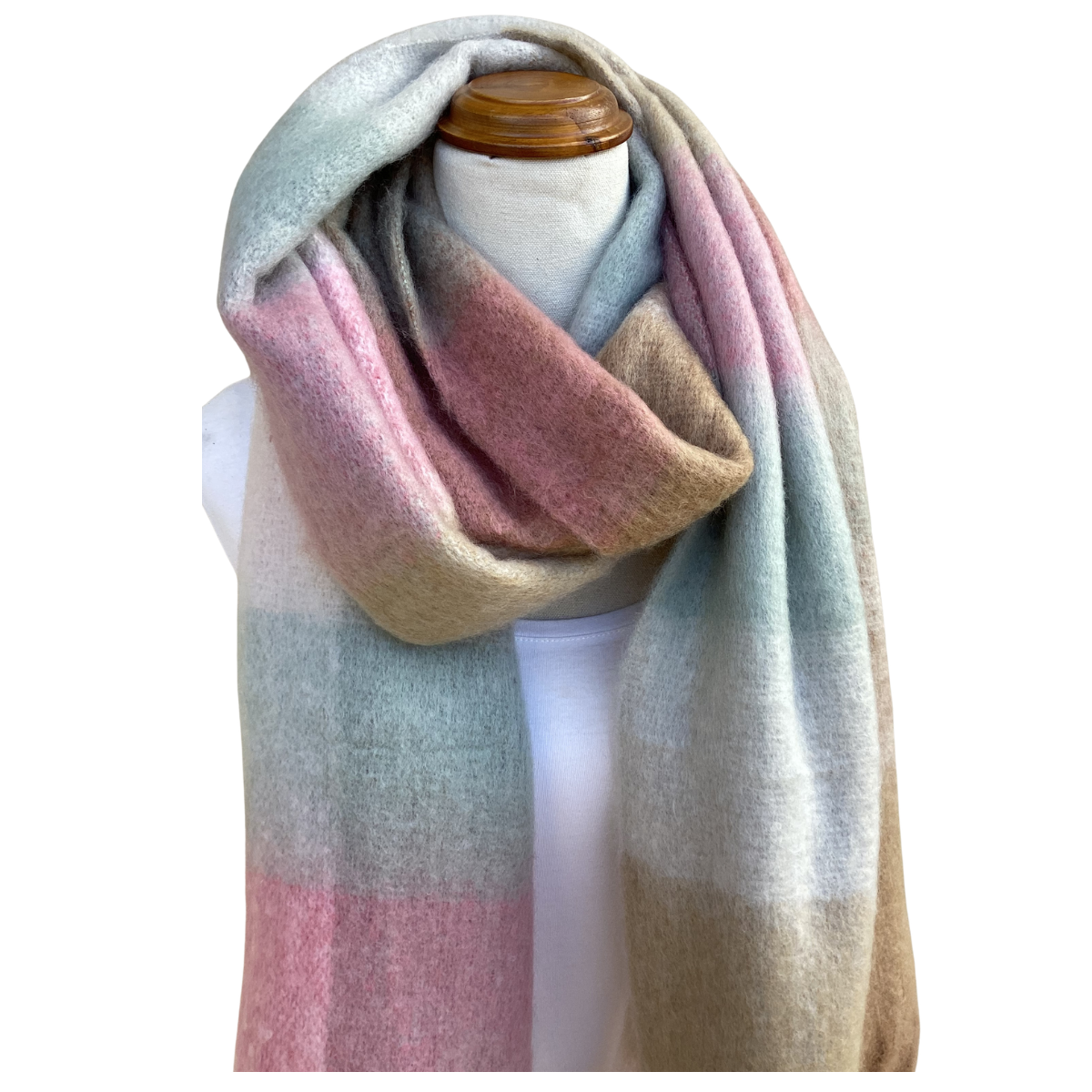 A soft, oversized scarf with a pastel gradient of pink, beige, and light blue-green, draped on a white mannequin torso with a wooden neck cap against a white background.