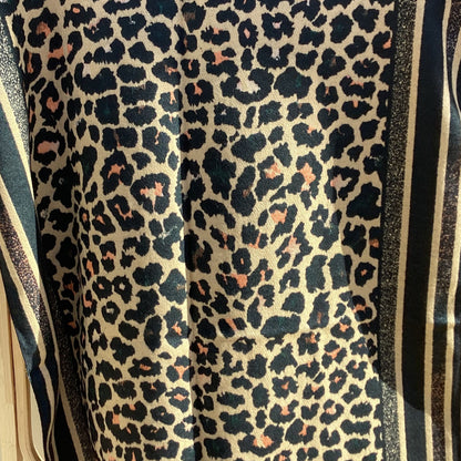 Leopard print scarf with a striped border on a white background