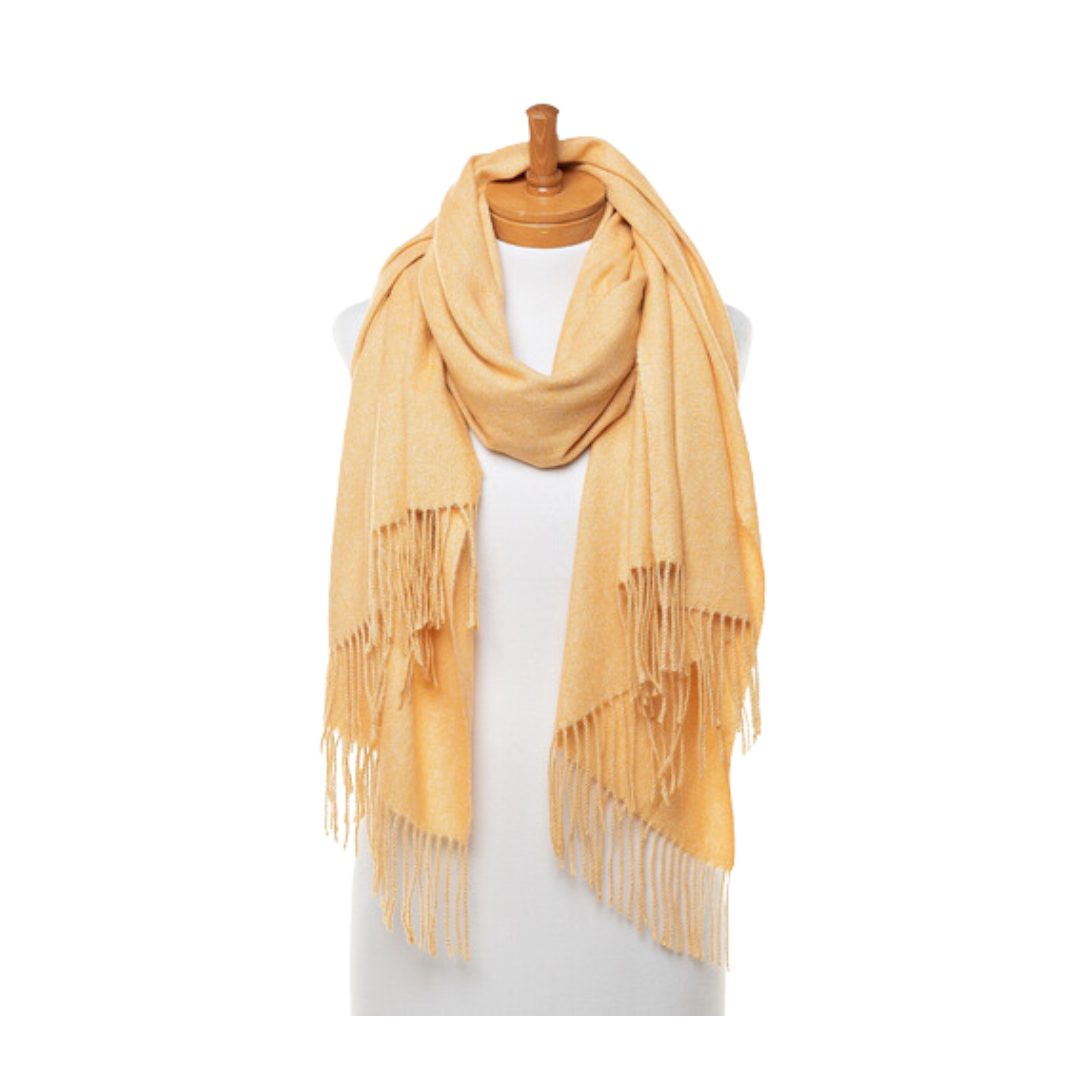 A soft and warm ladies scarf that is plain honey mustard colour with tassels. The scarf is draped around a mannequins neck.