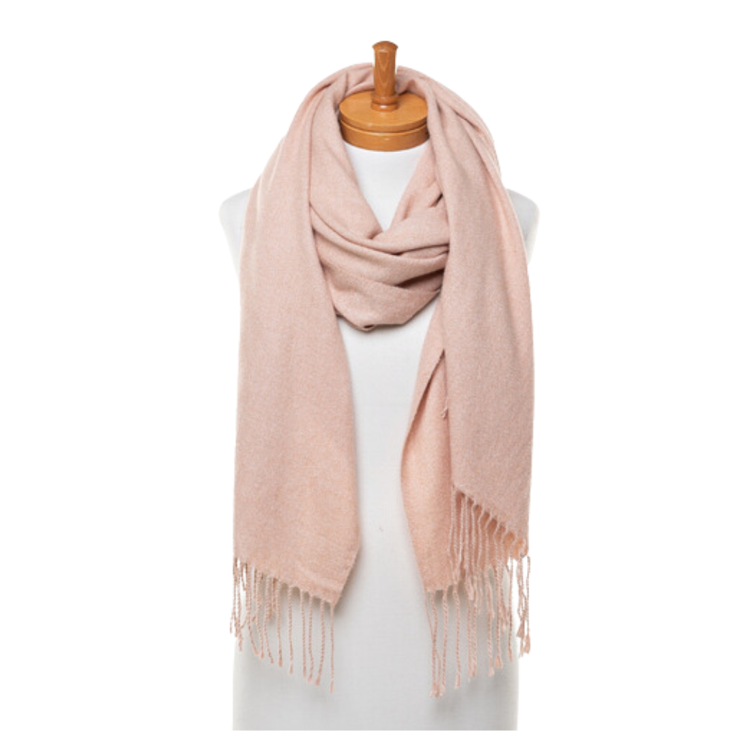 A soft and warm ladies scarf that has tassels and is draped around the neck of a mannequin.