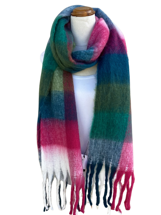 A multicolor striped cosy scarf with fringe ends, displayed on a white mannequin torso against a plain white background.